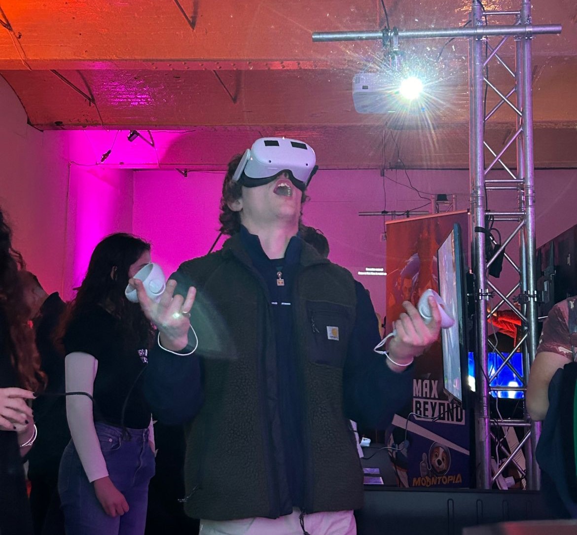 Man trying Retroverse game exclaiming with joy